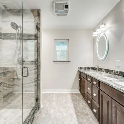 Remodeled master bathroom with tiled walk-in shower in Benbrook, Texas