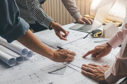 Architect,Man,Brainstorm,Collaboration,Ideas,Pointing,Blueprints,At,The,Office.